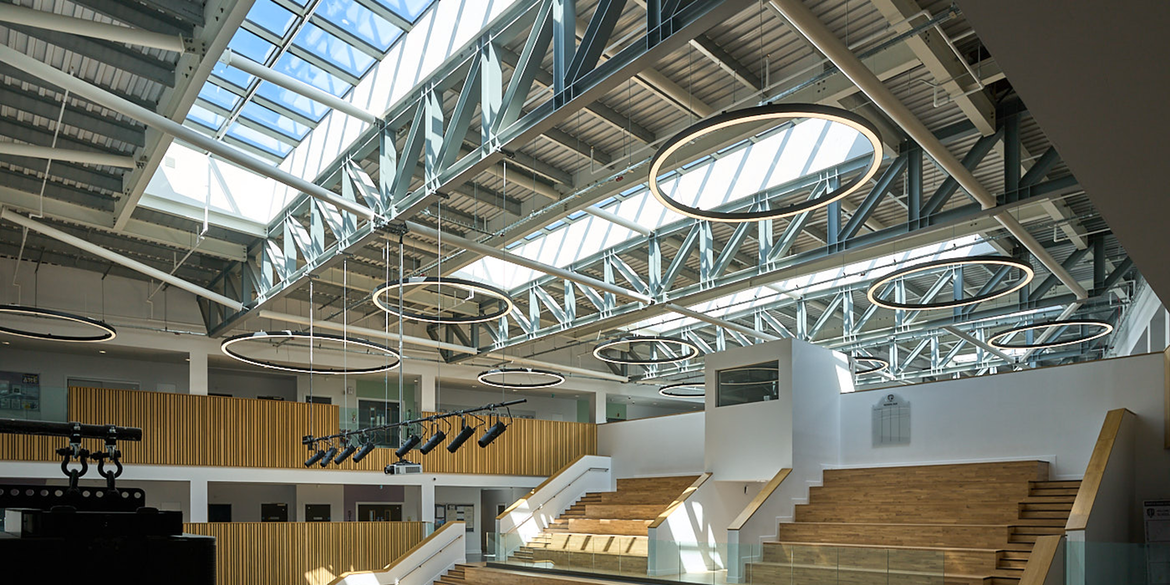 daylight filled atrium staircase with large glass rooflights