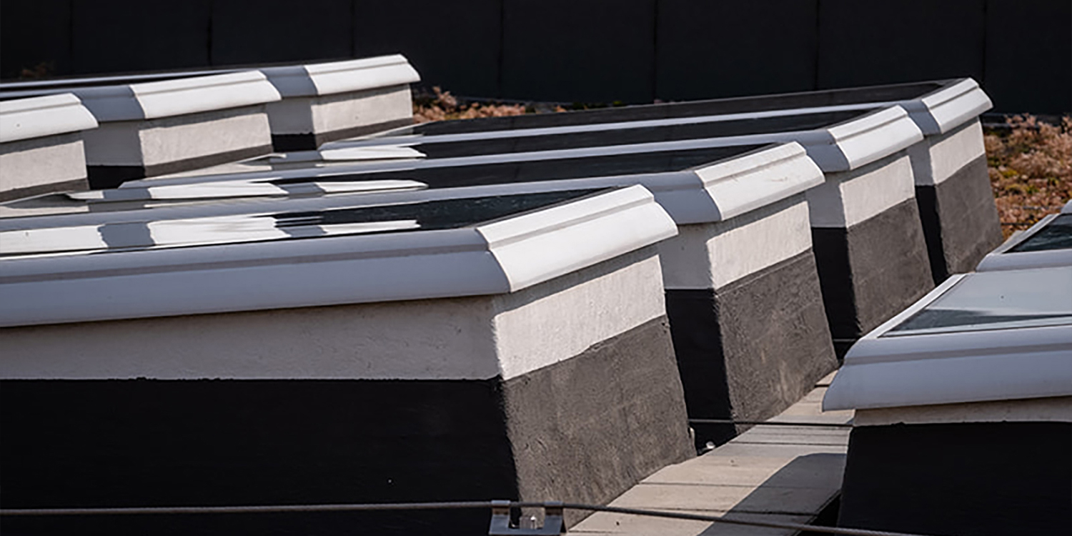 Row of rooflights assembled to upstands