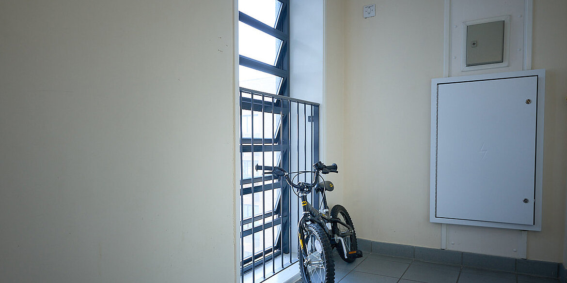 Bike leaning against glass louvre window