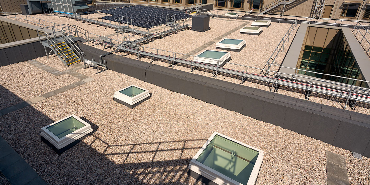 flat roof with multiple square rooflights with white frames