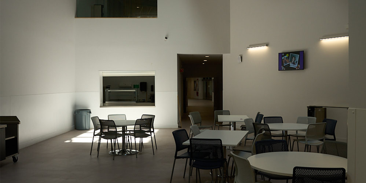 Internal classroom lit up with daylight from rooflight above